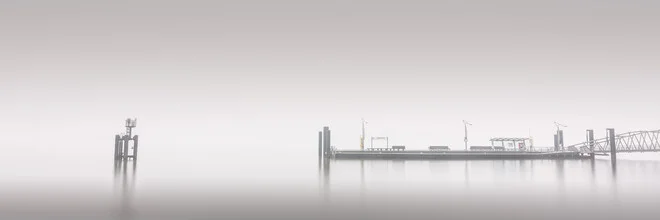 Panorama photo of the Elbphilharmonie at the ferry pier in Hamburg with soft fog.