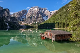 Serene Braies Lake reflecting the Dolomites in the background