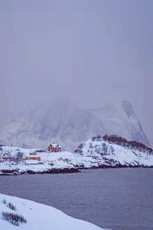 Red house in a winter landscape on Senja Island