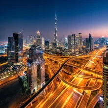 Panoramic view of the illuminated Dubai skyline during the blue hour
