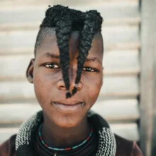 Photo art by Dennis Wehrmann: Portrait of a boy from Namibia with a calm expression.