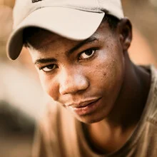 Photo art by Dennis Wehrmann: portrait of a boy from Namibia with an expressive face.