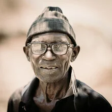 Portrait of a man from Zambia with a gentle smile and warm gaze
