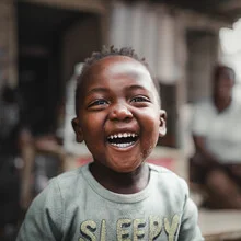 Photo art by Dennis Wehrmann: portrait of a laughing boy from Namibia.