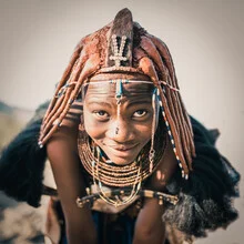 Photo art featuring a Himba woman in Namibia, warm lighting and traditional colors.