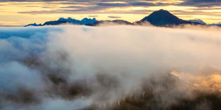 Photo art by Martin Wasilewski: Fog-covered mountains at sunrise
