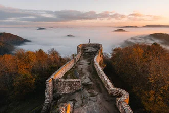 Wegelnburg in mist with soft sunset colors, by Johannes Hulsch.