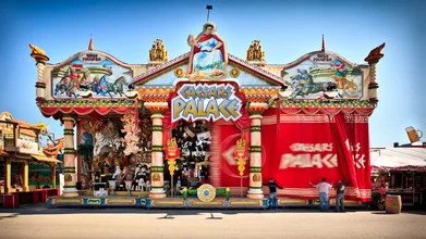 Photo art by Christoph Kalck: vibrant capture of a funfair in full swing
