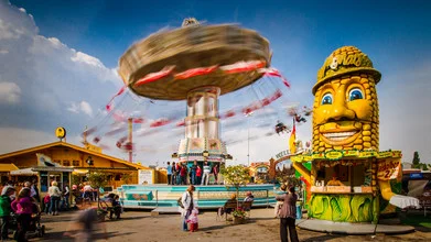 Photo art by Christoph Kalck: cheerful carousel at a funfair in Stuttgart