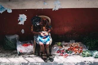 Wall art of an elderly woman selling fresh vegetables at a market in the Philippines