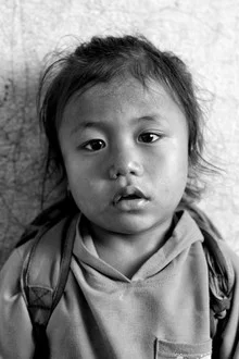 Smiling child in Nepal radiating innocence and joy.