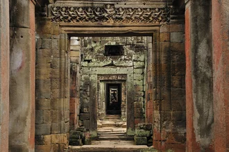 Photo art by Haifeng Ni: temple ruins in Cambodia beneath a wide sky