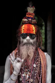 Photo art of a colorful Sadhu wearing sunglasses in Nepal, relaxed mood with vibrant colors.