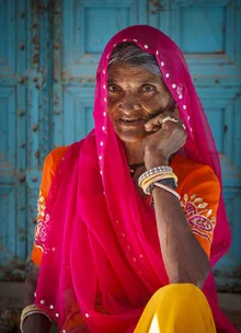 Portrait of an Indian woman in colorful garments, soft colors and expression.