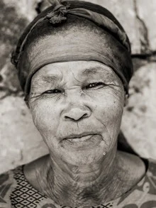 Photo art by Jörg Faißt: Portrait of a Namibian farm worker in traditional clothing.