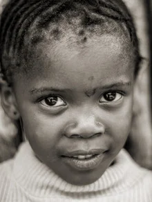 Portrait of a Namibian girl looking directly at the camera.