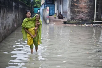 Wall art depicts the impact of monsoon floods on a city in Bangladesh.