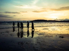 Photo art by Johann Oswald: Shell collector on the beach during sunset in Thailand
