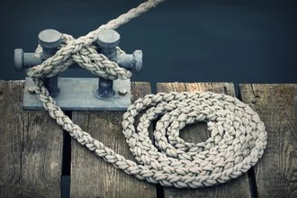 Photo art by Wenka-maria Hagemeister: a rope on a dock, evoking a maritime atmosphere