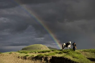 Photo art by Schoo Flemming: Rider in the Mongolian steppe under stormy skies