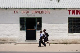 Photo art by Franzel Drepper: Children from Kongola walking in the sun towards the store.