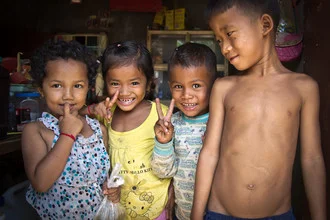 Photo art by Christoph Creutzburg: joyful Cambodian kids playing together.