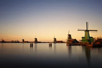 Photo art: Windmills at sunset, tranquil atmosphere in the Netherlands