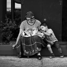 Photo art by Nasos Zovoilis: A boy takes care of his newborn brother.