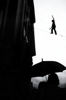 Photo art by Radoslaw Celewicz: rope dancer balancing on a thin rope.