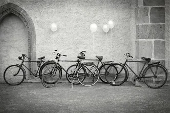 Photo art by Elvira Stürmer: bicycles in a romantic street scene with balloons