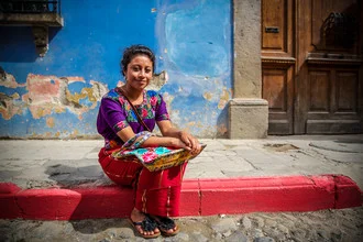 Portrait of a woman in traditional clothing from Guatemala, soft colors and a gentle expression.