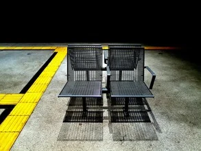 Photo by Anuschka Wenzlawski: seating areas in an urban space with shadows and light patterns.