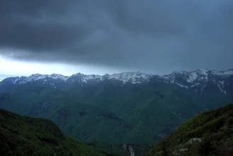 Photo art by Björn Groß: serene mountain landscape with ridge and rain
