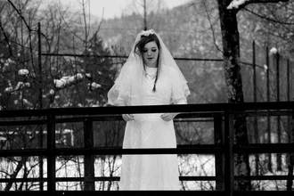 Wedding photography: bride in the Black Forest with snow-covered trees