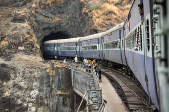 Wall art by Soenke Schulze: train journey through a tunnel in Hampi, India.