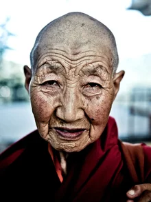 Photo of a female Buddhist monk in a temple in India