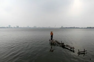 Photo art by Florian Justus Jaeger: Angler by the lake in Hanoi, Vietnam.
