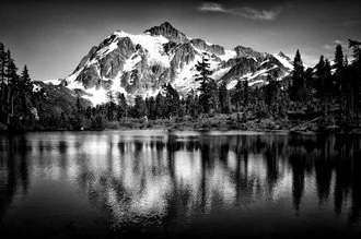 Photo art by Jianwei Yang: serene mountain view reflecting on the lake