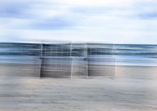 Photo art by Alexander Barth: dynamic movement at the Baltic Sea beach with beach chairs