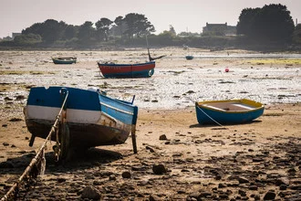 Photo art: boats in the harbor at low tide, gentle waves and calm coastal mood