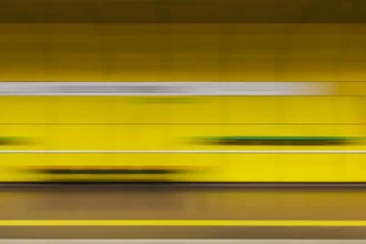 Photo art featuring motion elements: dynamic subway scene in warm colors