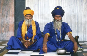 Photo art by Martin Seeliger: two elderly Sikh veterans in traditional attire