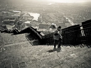 Photo art by Rob Smith: street cleaner on stone steps in an urban landscape