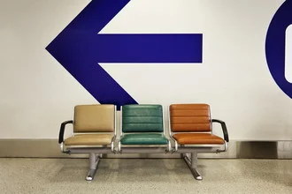 Photo art by Jeff Seltzer: empty airport chairs in a harmonious arrangement
