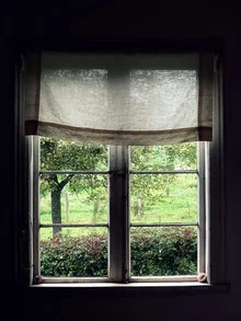 Photo art by Anuschka Wenzlawski: nostalgic view from a window into a garden.