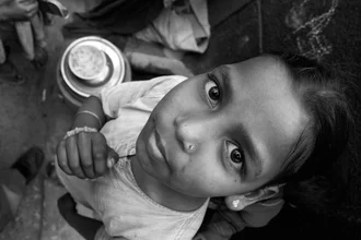 A girl from India with amazed eyes observing the world around her.