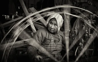 Photo art by Rob Smith: a woman spinning wool in a traditional village in China.