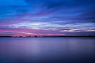 Photo art by Andi Weiland: calm blue sea at sunset