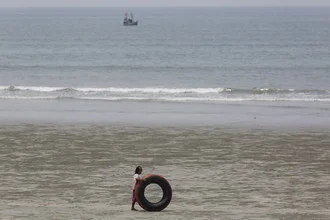Photo art by Michael Belhadi: girl on the beach in Maungmagan, Myanmar.