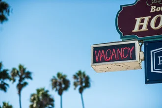 Photo art by Lars Jacobsen: palm trees and neon sign in San Clemente, California